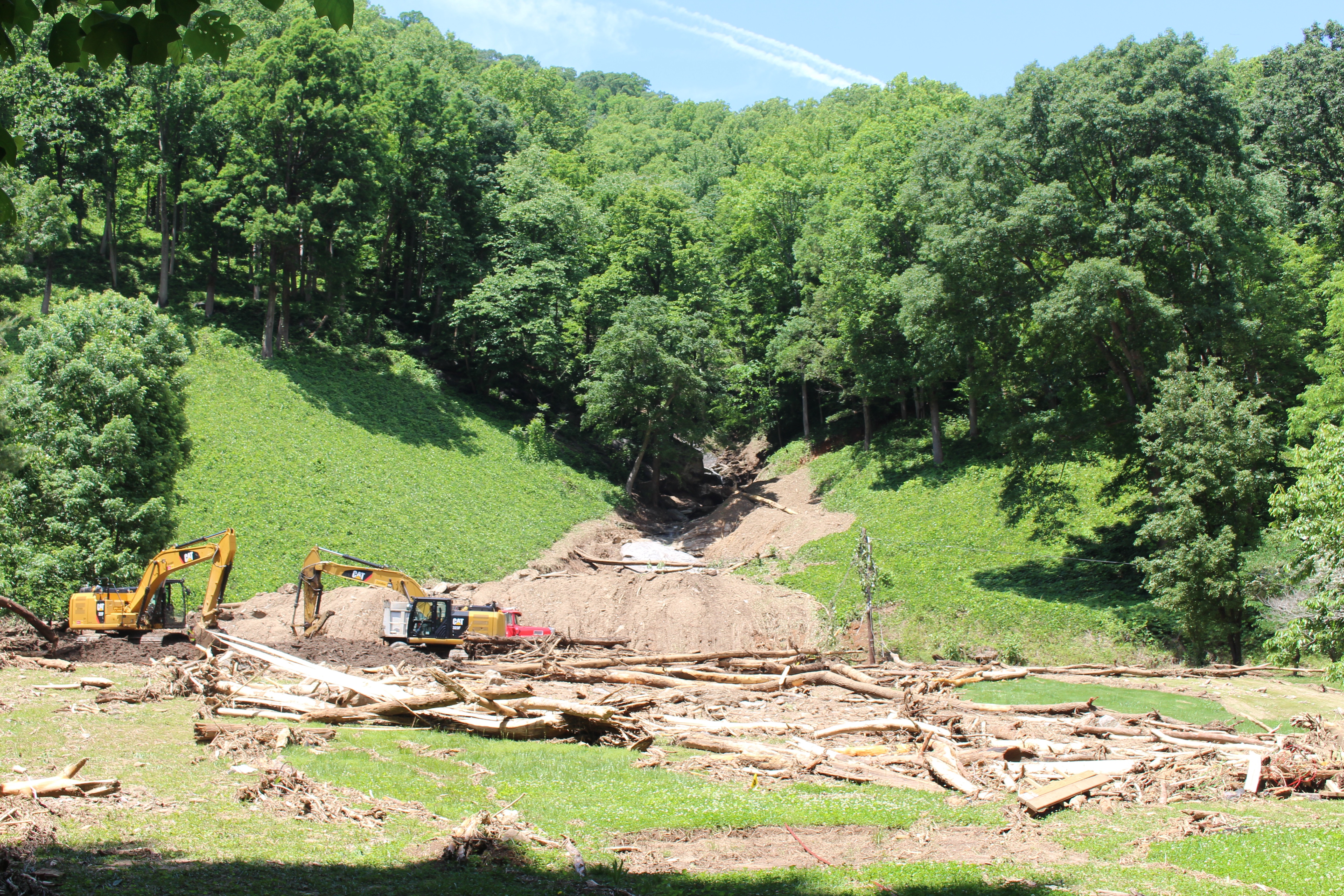 Damage from a landslide that covered U.S. Highway 176 and neighboring properties in Polk County, North Carolina on the night of May 18, 2018, showing extensive debris across the road and surrounding land
