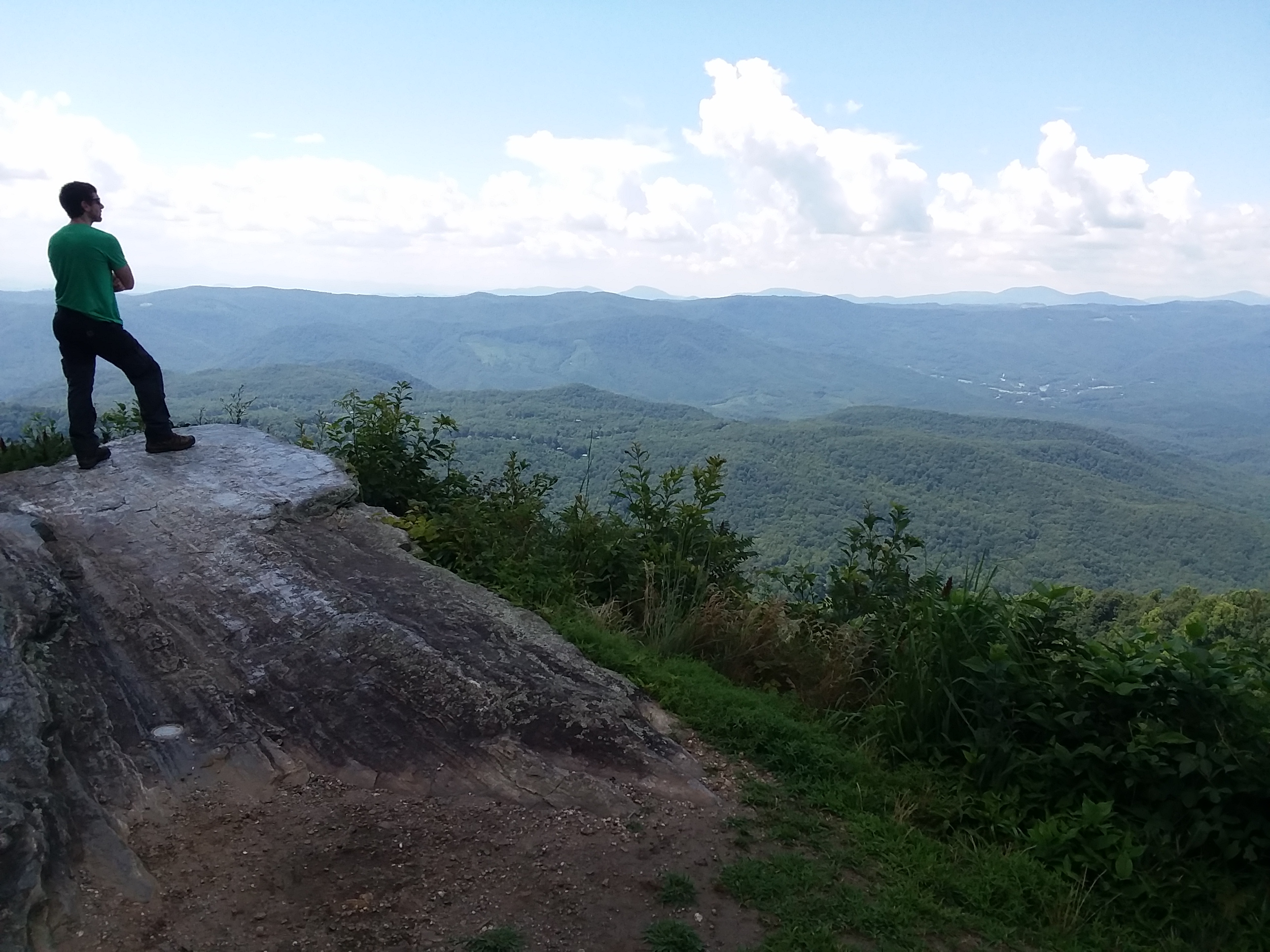 Person standing at a mountain overlook in Western North Carolina